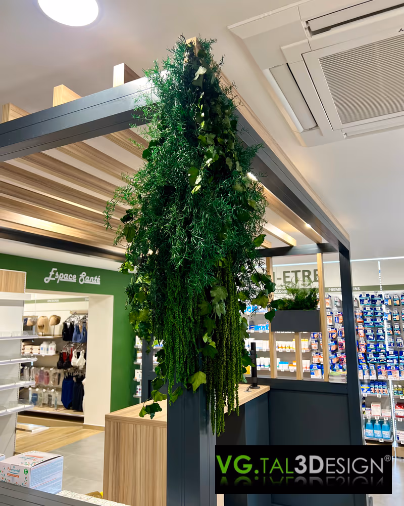 Cascading foliage above a pillar in a Ham pharmacy